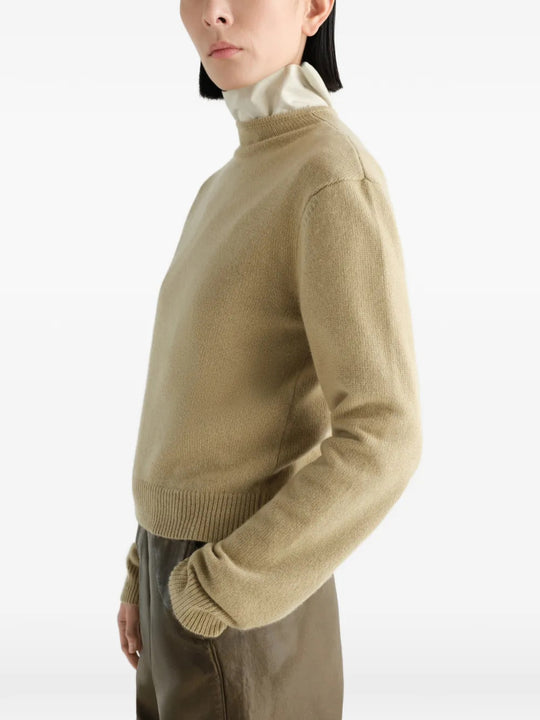 Tan hoodie worn by a person, showing the hoodie fit