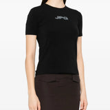 Black shirt worn by a person, showing the shirt fit