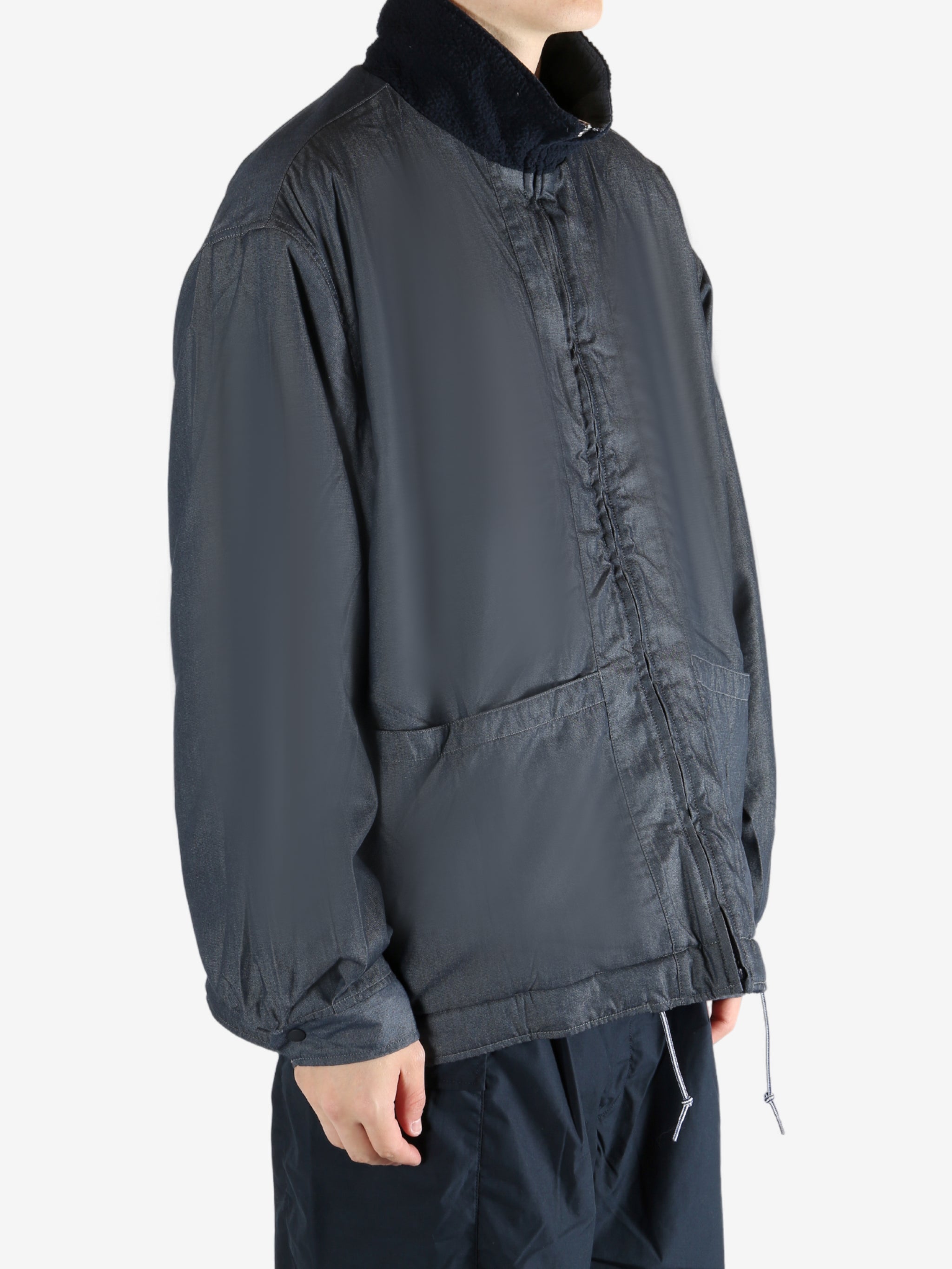 Navy jacket worn by a person, showing the jacket's fit