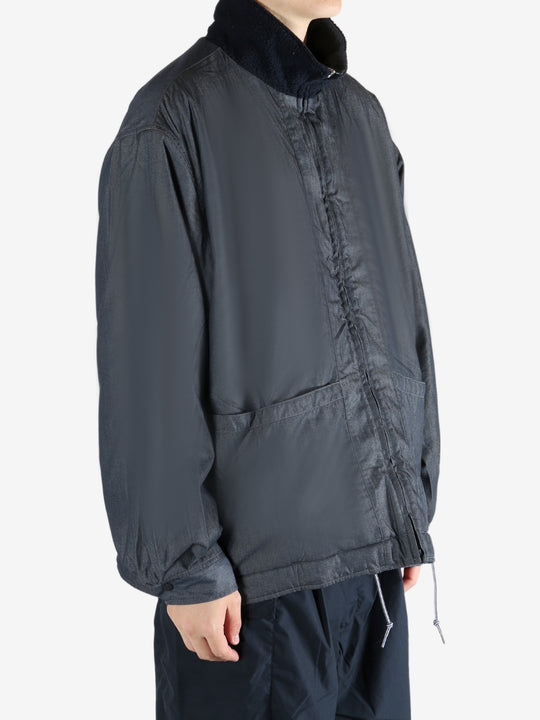 Navy jacket worn by a person, showing the jacket's fit