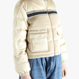 Tan jacket worn by a person, showing the jacket's fit