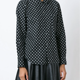Black shirt  worn by a person, showing the shirt's fit
