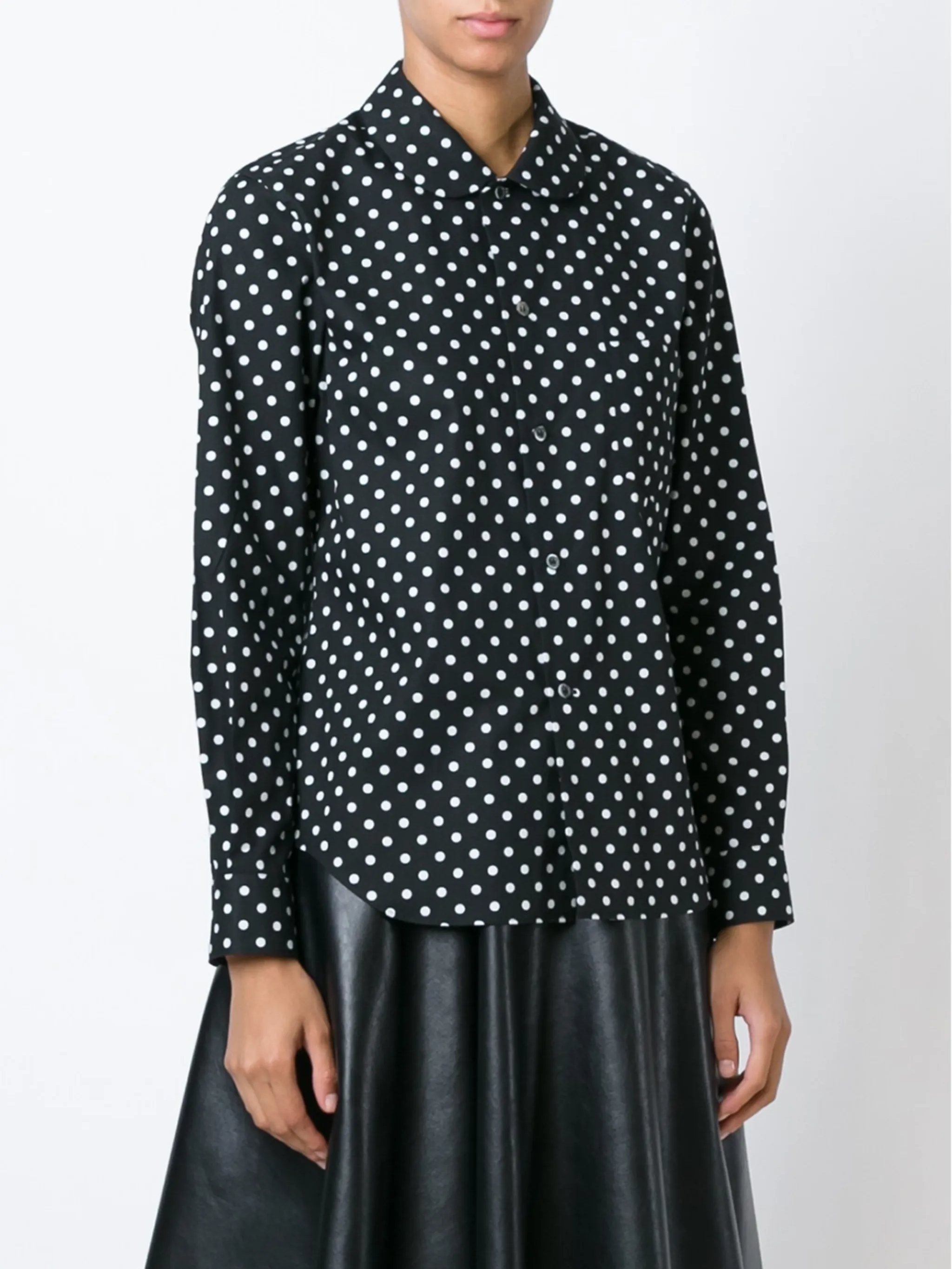 Black shirt  worn by a person, showing the shirt's fit