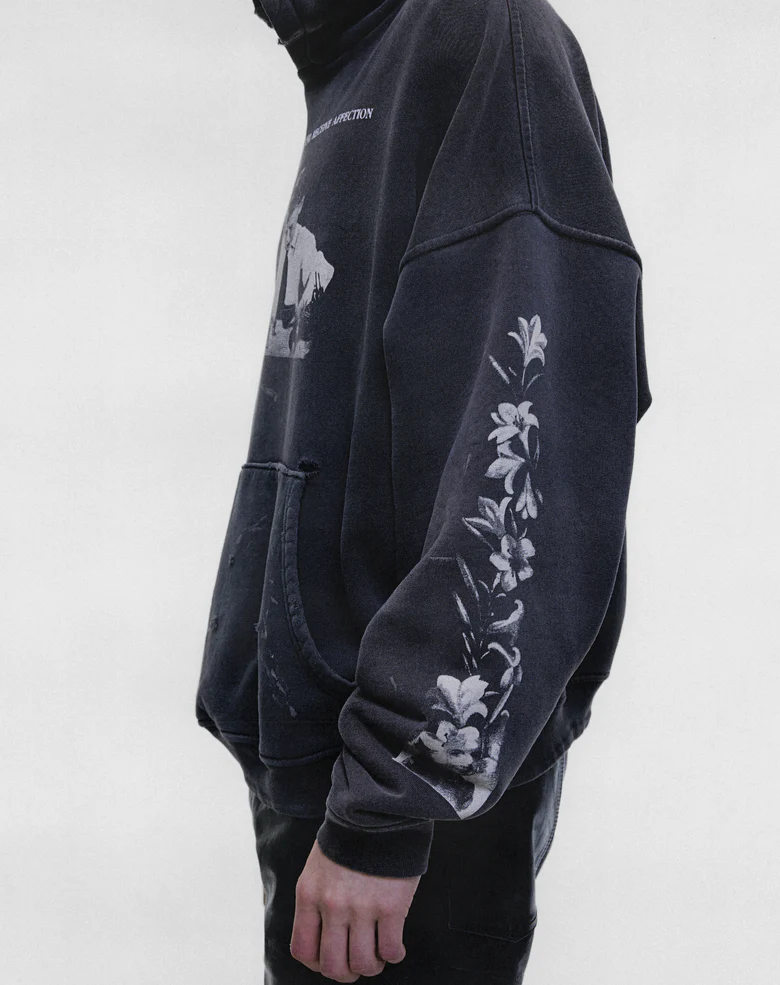 Black hoodie worn by a person, showing the hoodie fit