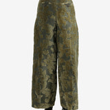 Green pants worn by a person, showing the pants' fit