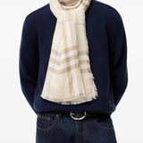 Tan scarf worn by a person, showing the scarf fit