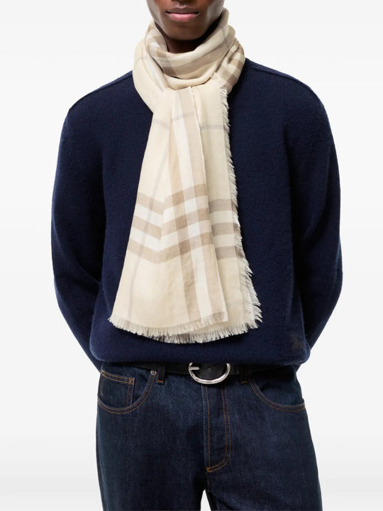 Tan scarf worn by a person, showing the scarf fit