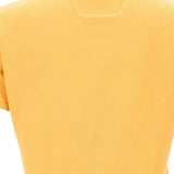 Close up of yellow tops, showing texture of the cotton fabric