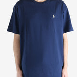 Navy blue t-shirt worn by a person, showing the shirt's fit