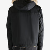 Black jacket worn by a person, showing the jacket fit