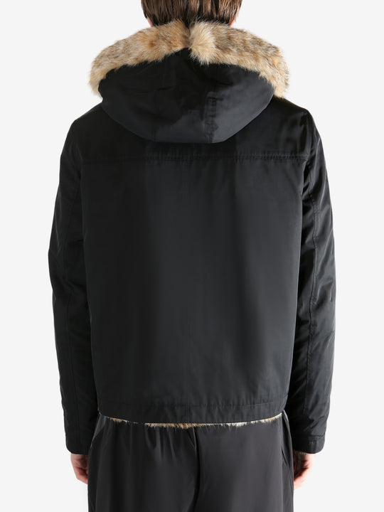 Black jacket worn by a person, showing the jacket fit