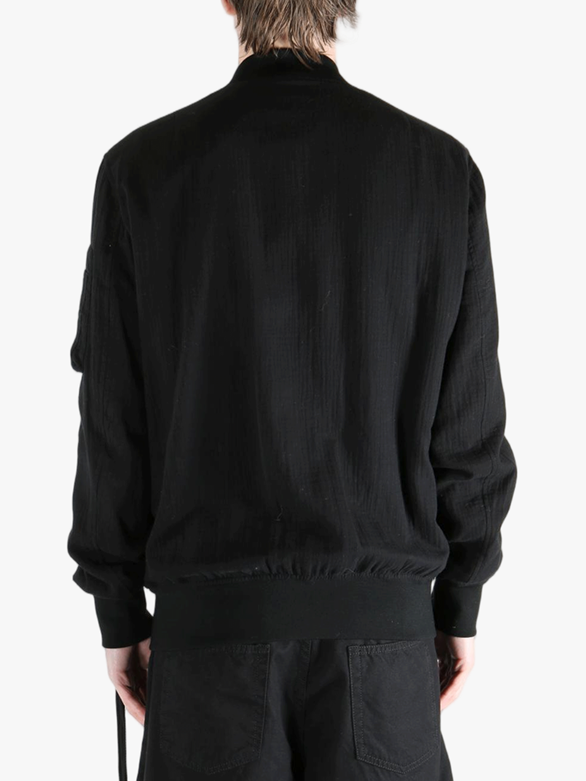 Black jackets-coats worn by a person, showing the cotton fit