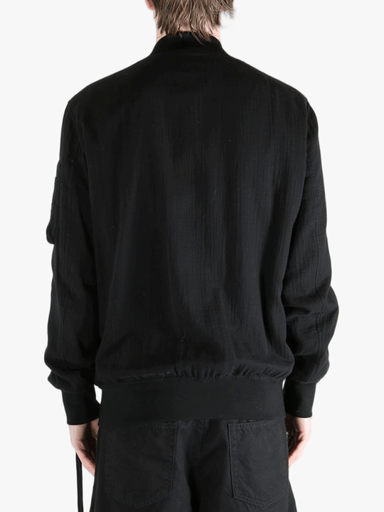 Black jackets-coats worn by a person, showing the cotton fit