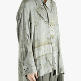 Green shirt worn by a person, showing the shirt's fit