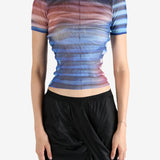 Blue t-shirt worn by a person, showing the shirt's fit