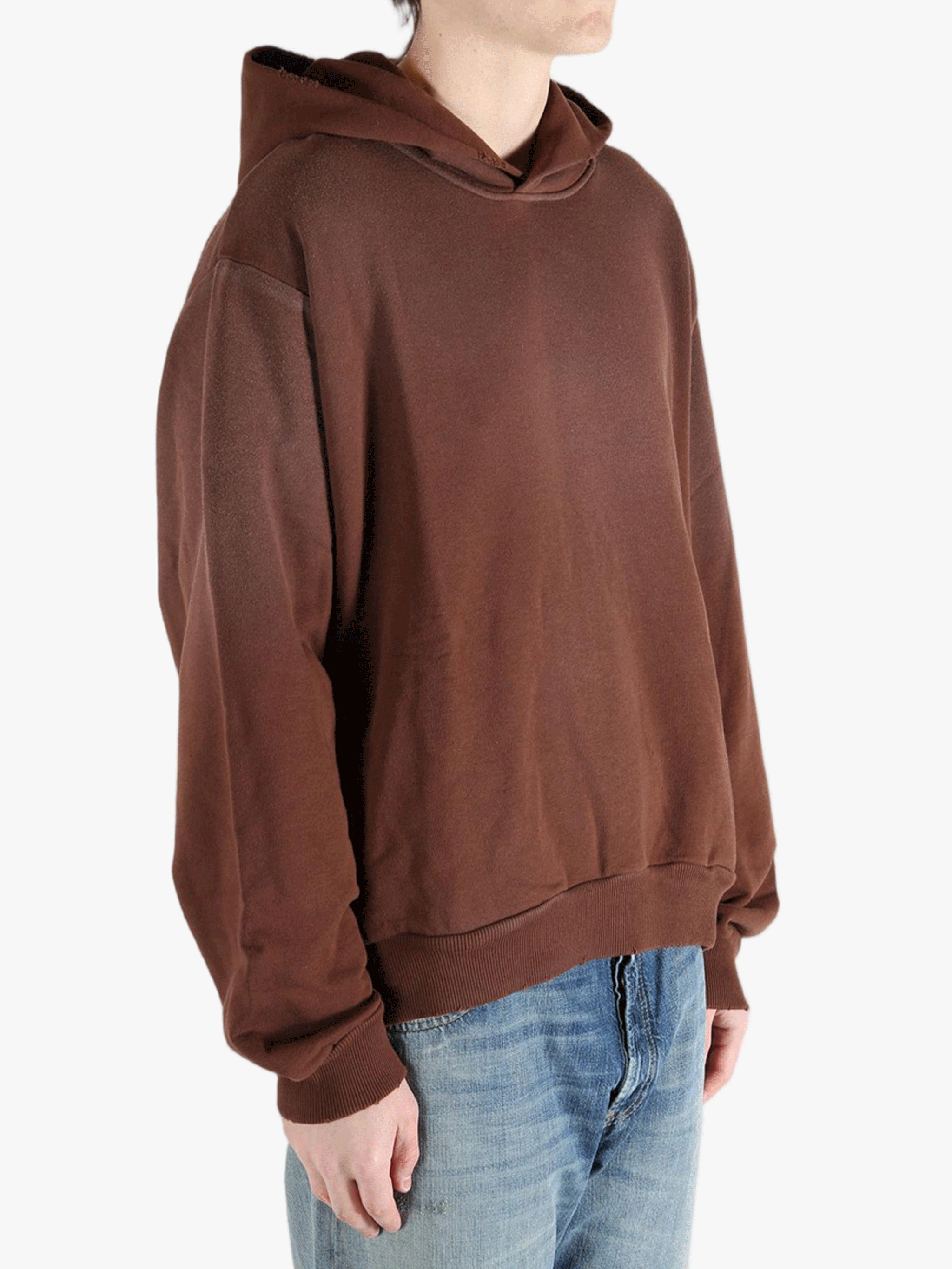 Brown sweats-hoodies worn by a person, showing the cotton fit