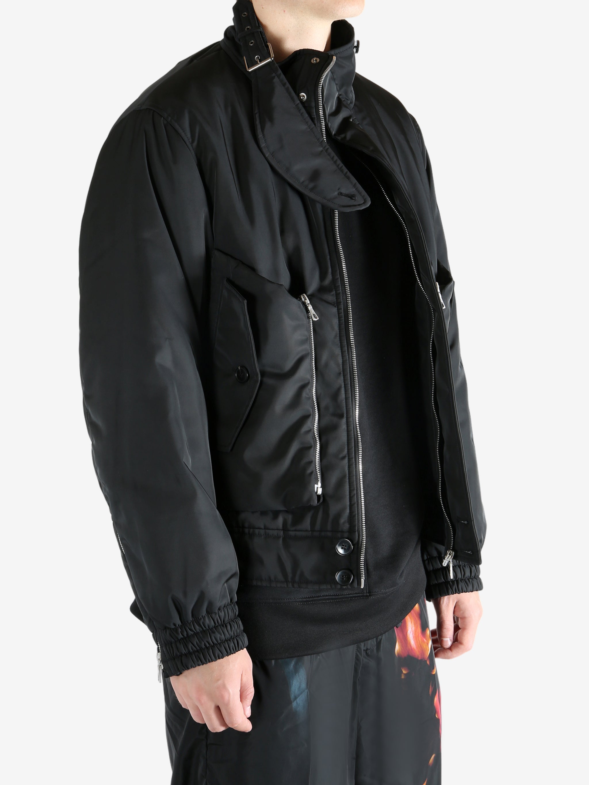 Black jacket worn by a person, showing the jacket's fit