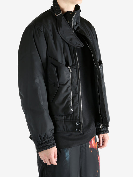 Black jacket worn by a person, showing the jacket's fit