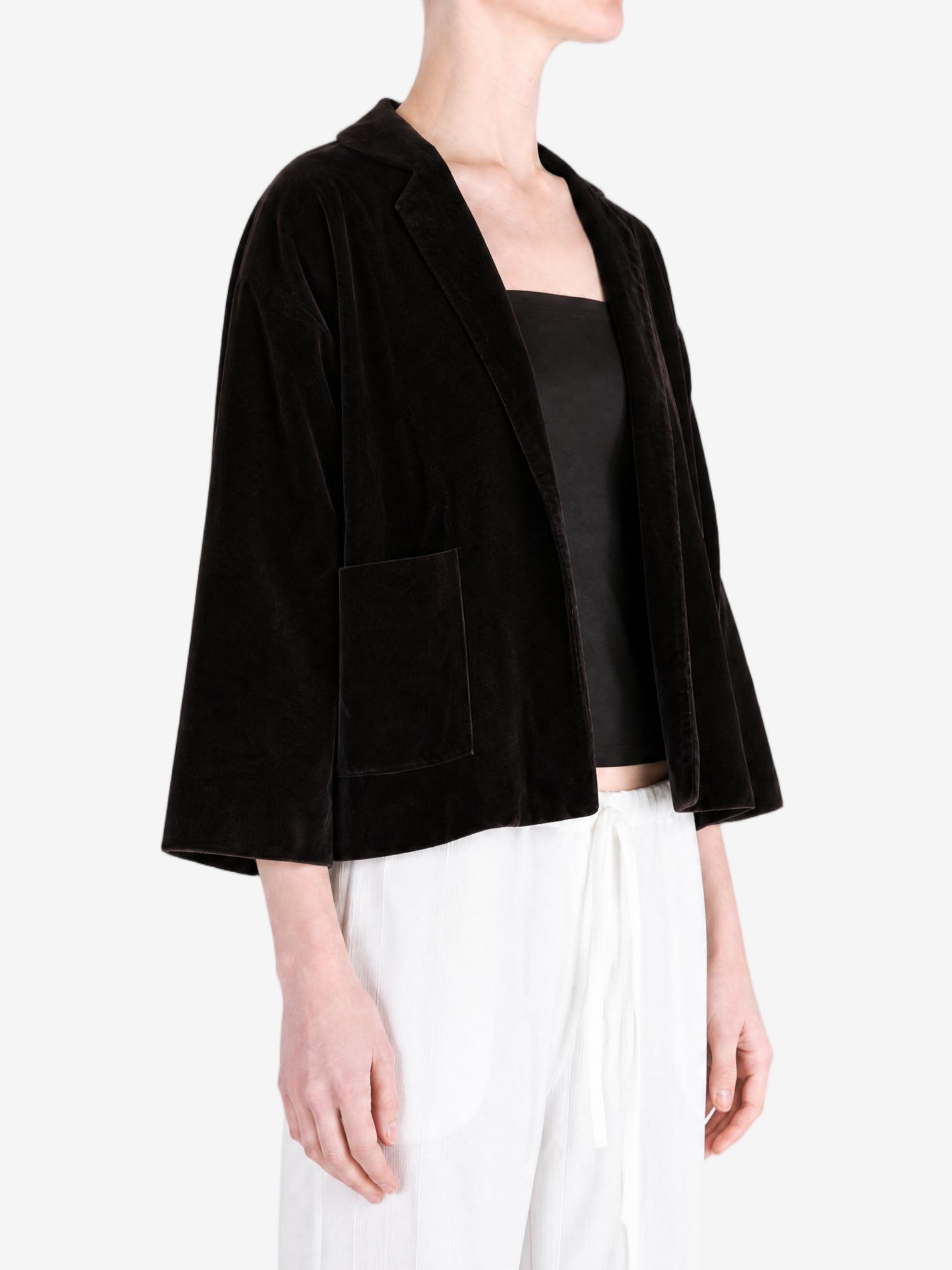 Black jacket worn by a person, showing the jacket fit