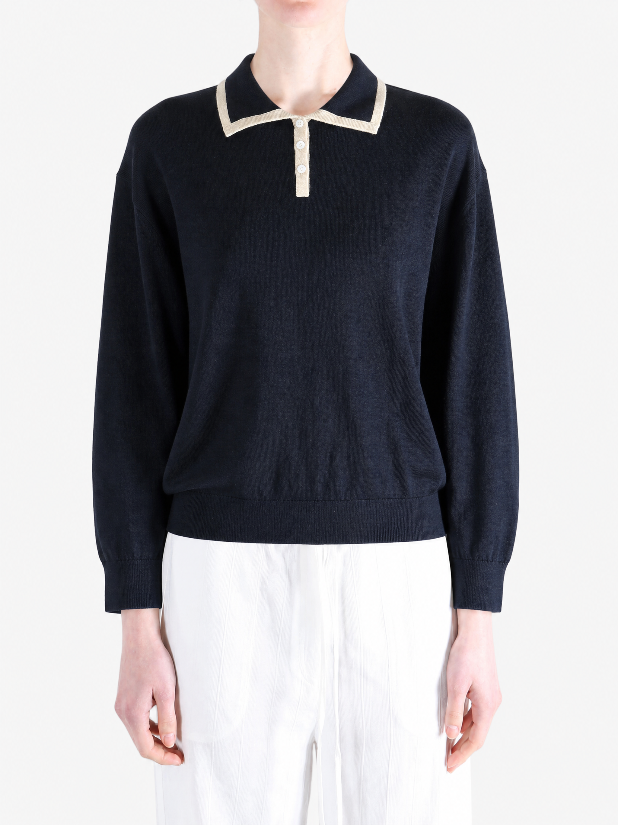 Navy shirt worn by a person, showing the shirt fit