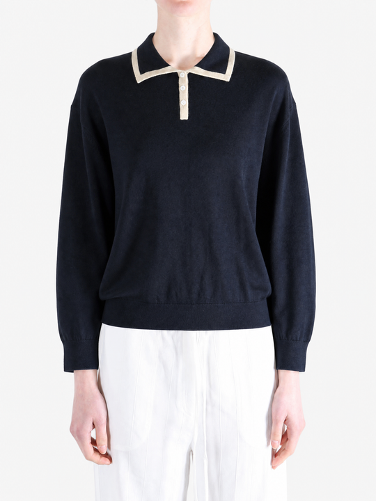 Navy shirt worn by a person, showing the shirt fit
