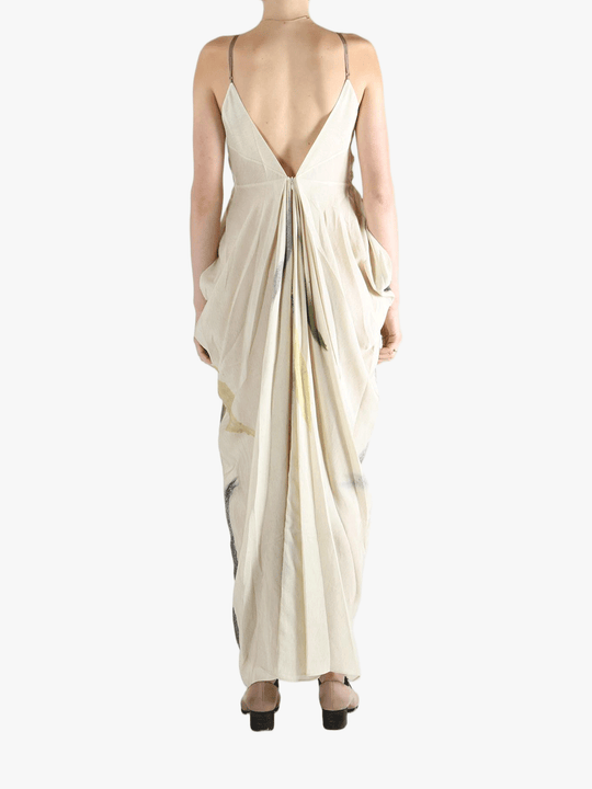 Tan dresses worn by a person, showing the dresses' fit