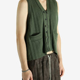Green vest worn by a person, showing the vest fit