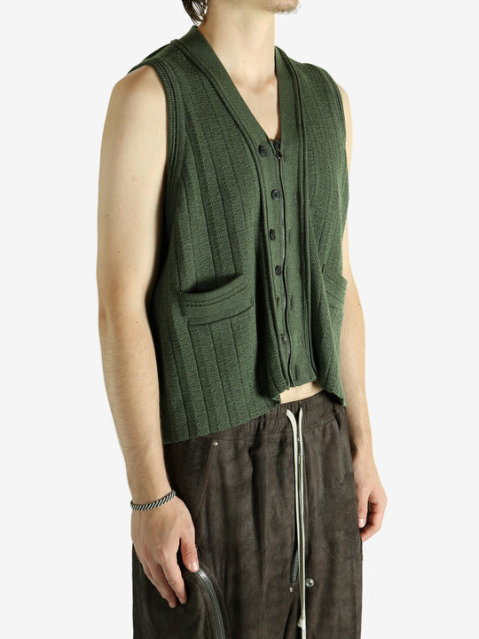 Green vest worn by a person, showing the vest fit