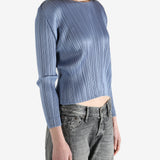 Blue top worn by a person, showing the top's fit