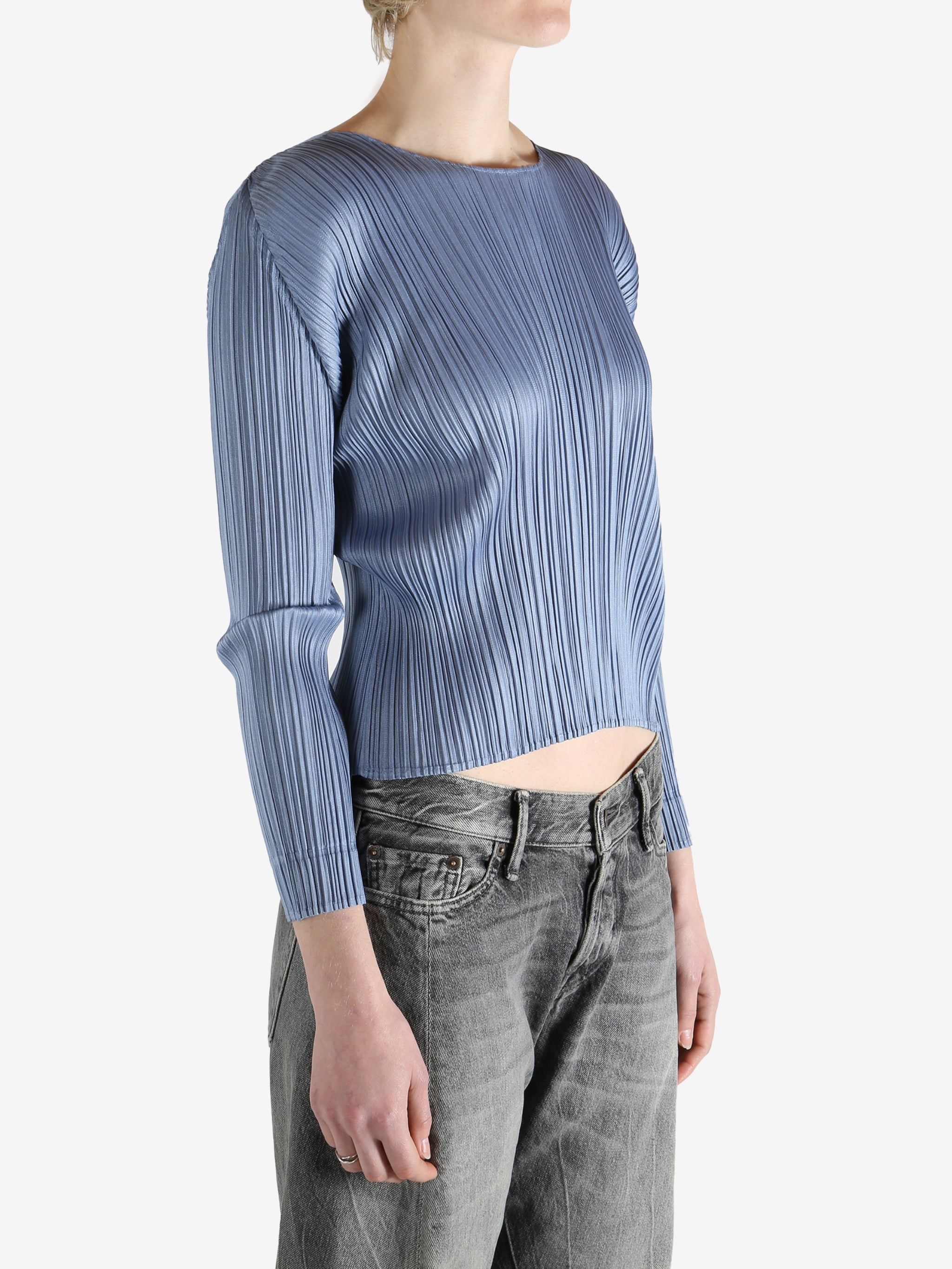 Blue top worn by a person, showing the top's fit
