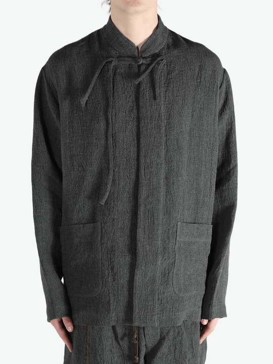 Grey jacket worn by a person, showing the jacket's fit