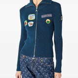 Blue jacket worn by a person, showing the jacket fit
