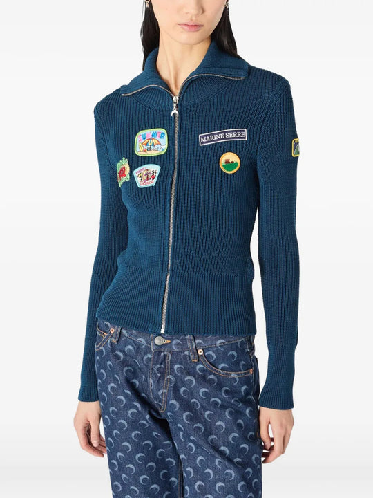 Blue jacket worn by a person, showing the jacket fit