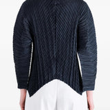 Navy knitwear worn by a person, showing the knitwear fit