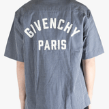 Blue checkered shirt worn by a person, showing the shirt's fit