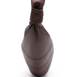 Close up of brown bag, showing texture of the leather fabric