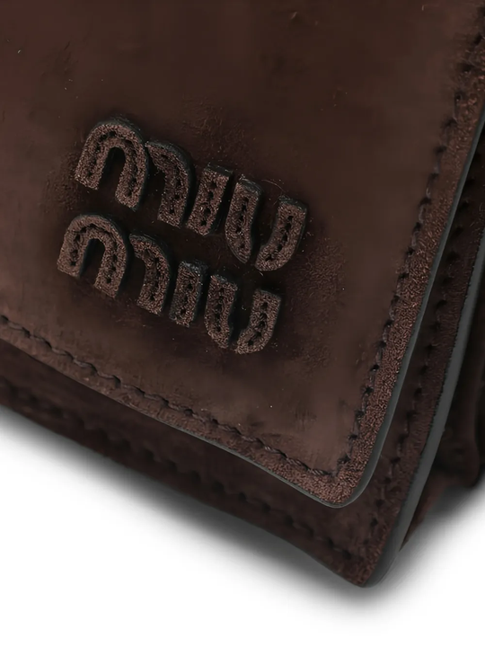 Close up of brown bag, showing texture of the Calf Leather fabric