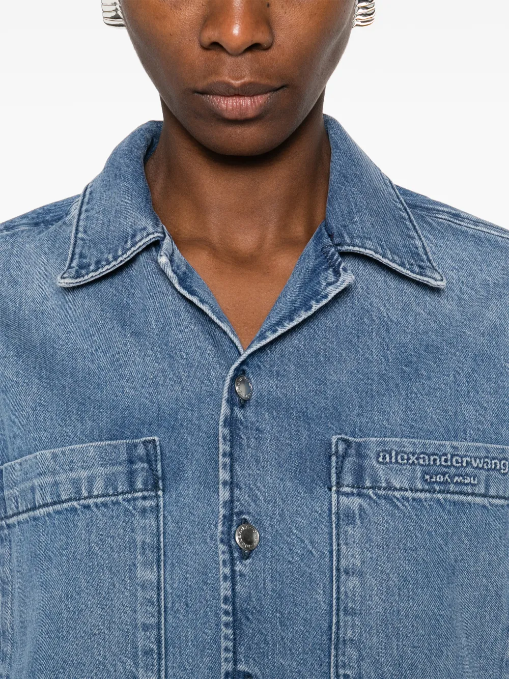 Close up of blue shirt, showing texture of the Cotton fabric