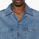 Close up of blue shirt, showing texture of the Cotton fabric