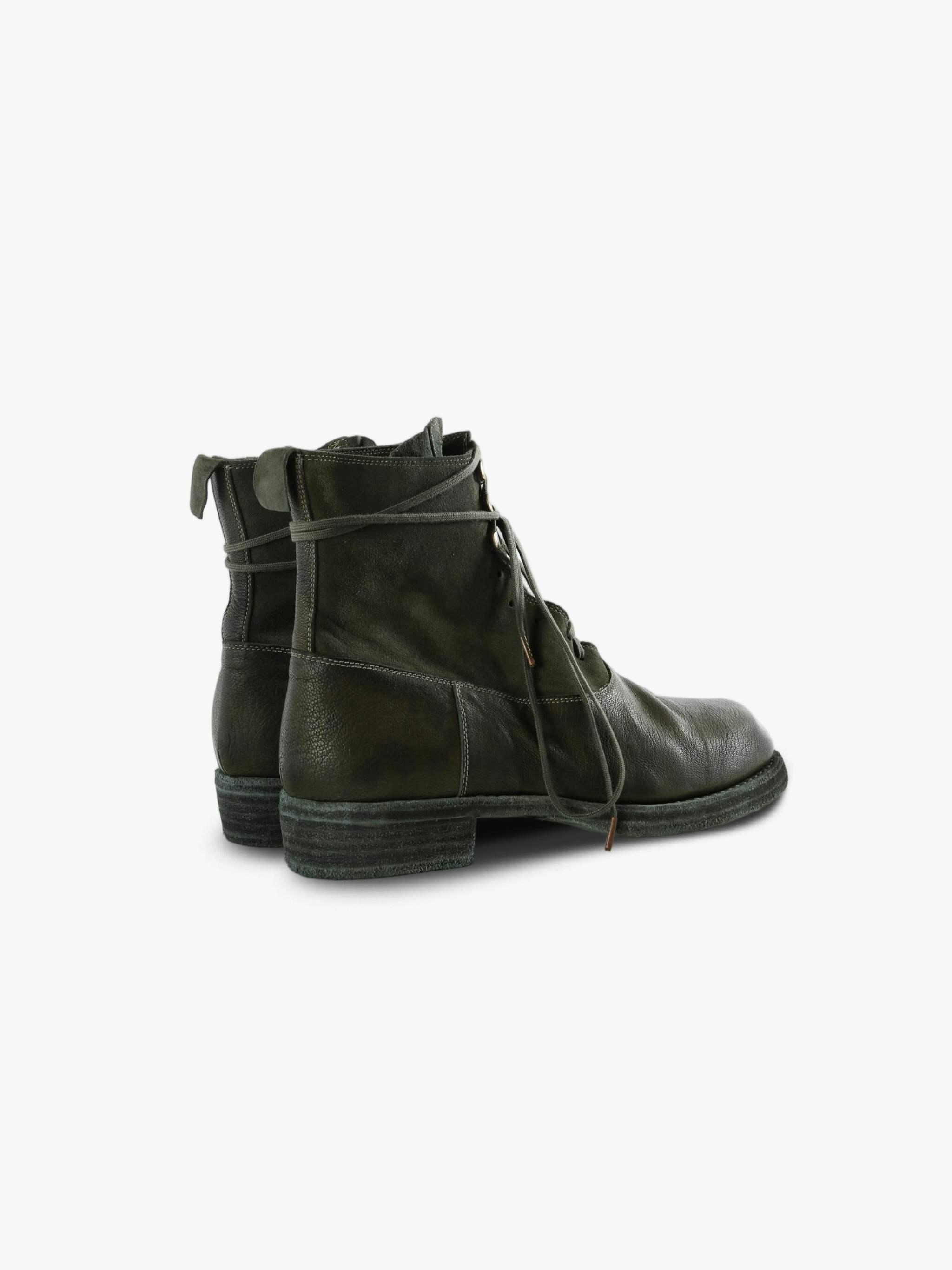 Green boots, back view