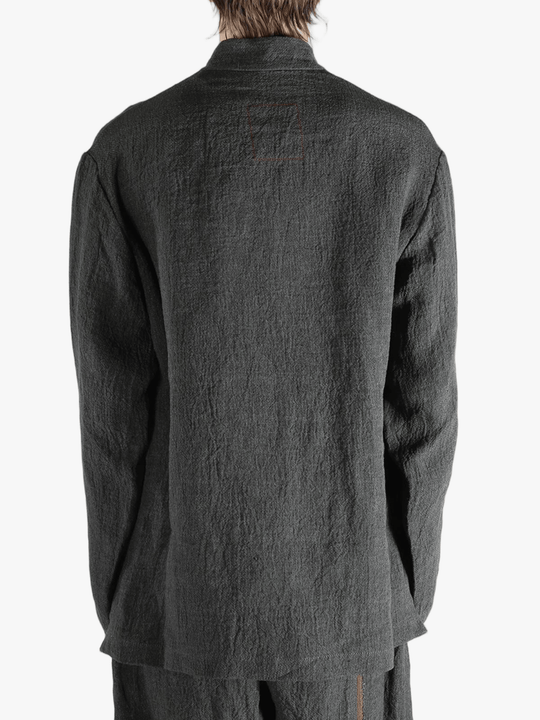 Grey jacket worn by a person, showing the jacket's fit