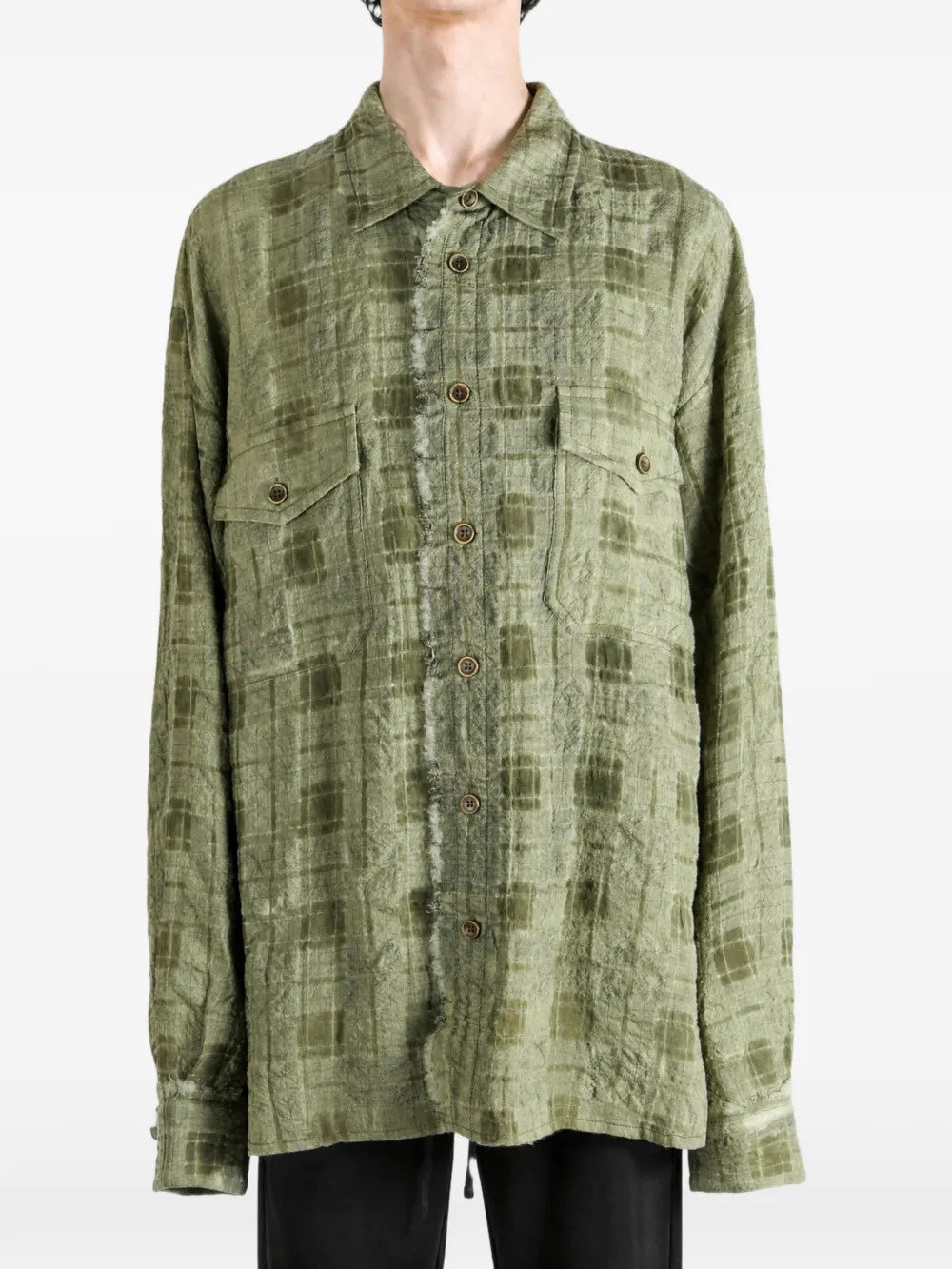 Green top worn by a person, showing the top fit