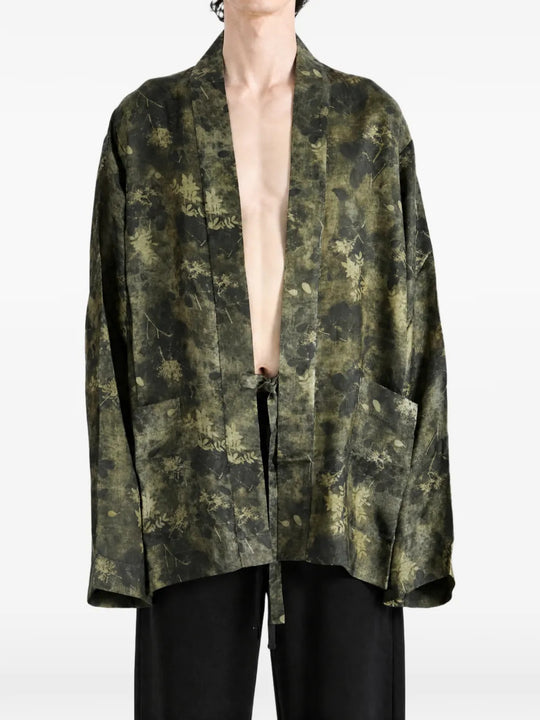 Green jacket worn by a person, showing the jacket fit