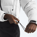 White jacket worn by a person, showing the jacket fit