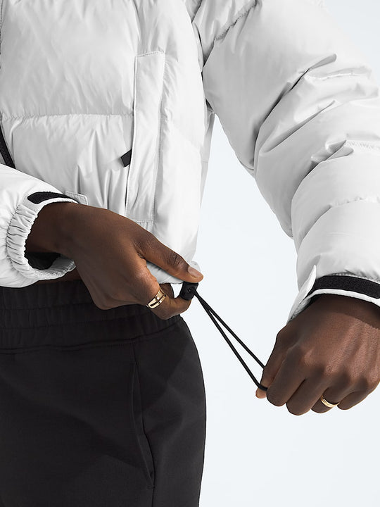 White jacket worn by a person, showing the jacket fit
