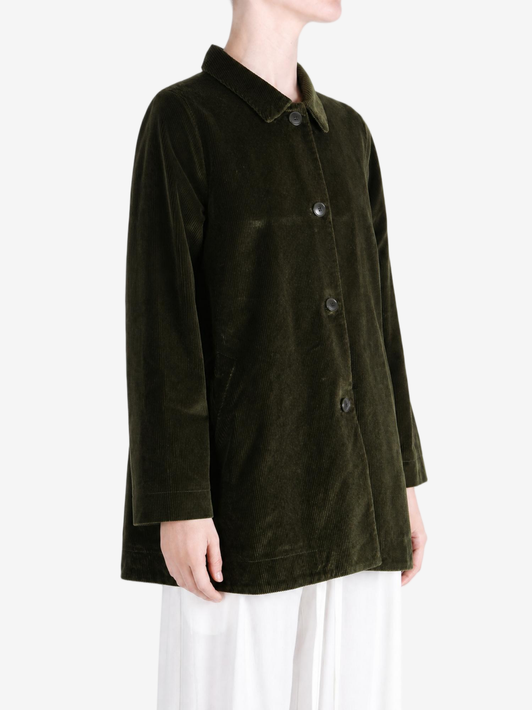 Green jacket worn by a person, showing the jacket fit