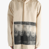 Tan jacket worn by a person, showing the jacket's fit