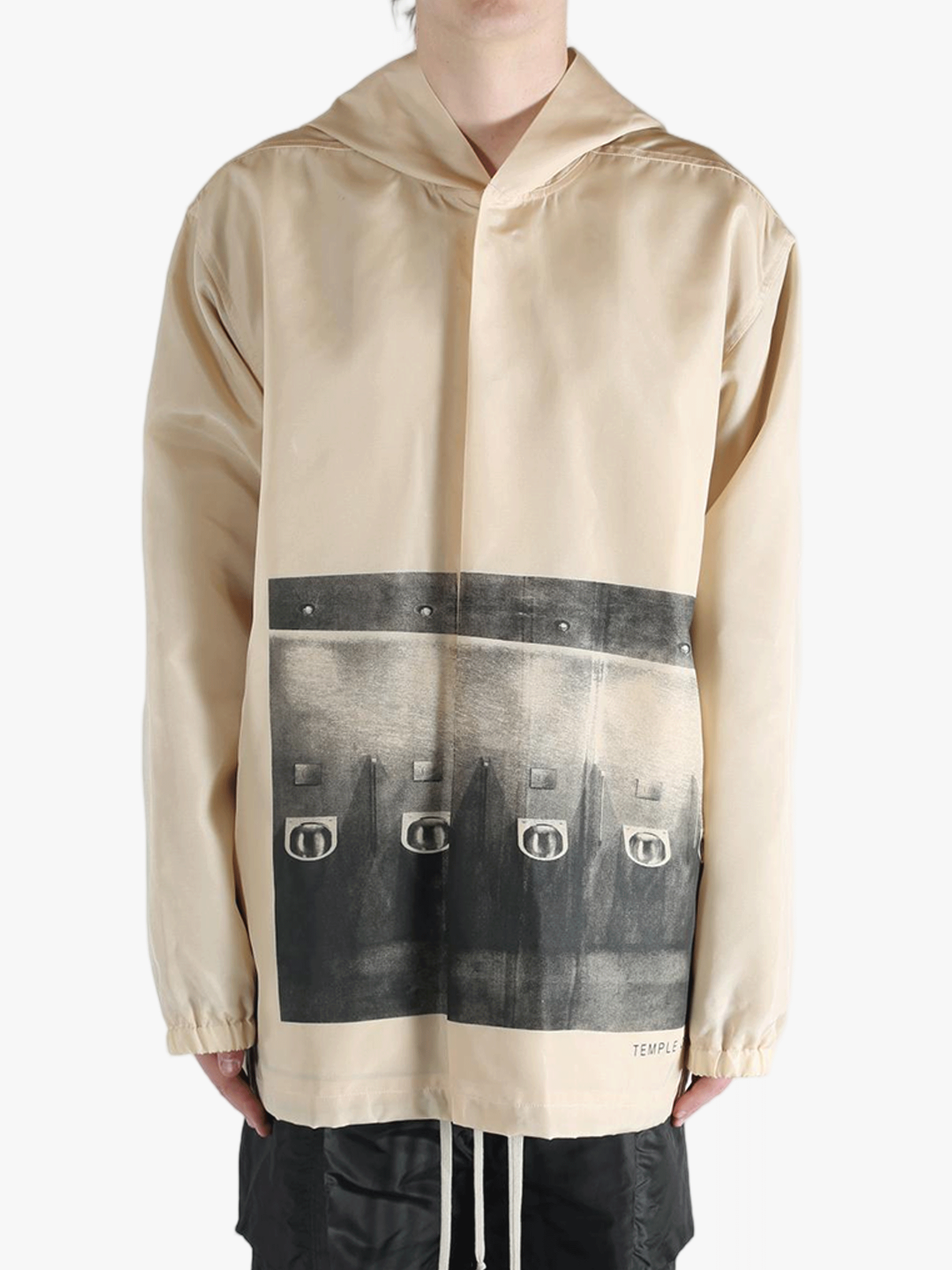 Tan jacket worn by a person, showing the jacket's fit