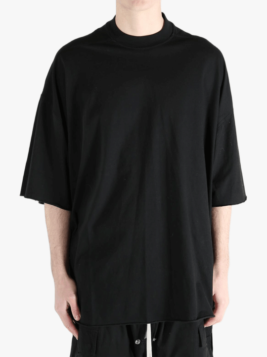 Black t-shirts worn by a person, showing the t-shirts fit