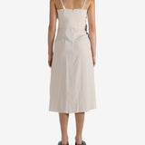 White dress worn by a person, showing the dress's fit